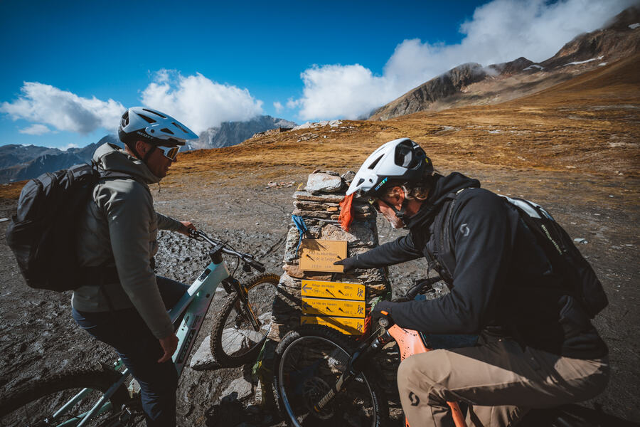 A trailside stop on a high col, the crew toolbox open